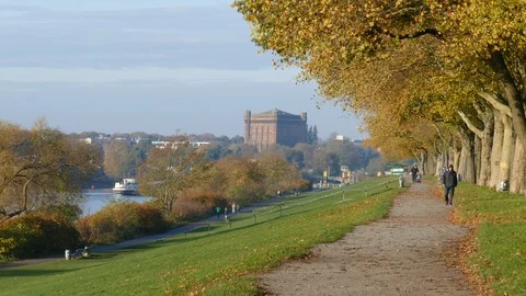Path and river Weser with old Water Tower in autumn, Bremen, Germany, Europe Stock Footage 122025430