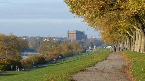 Path and river Weser with old Water Tower in autumn, Bremen, Germany, Europe Stock Footage 122025960