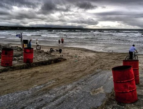 The Path to the Beach with Red Barrels on the Side Stock Photos
