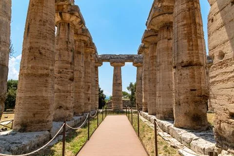 Path between Doric columns in ancient temple of Paestum Stock Photos