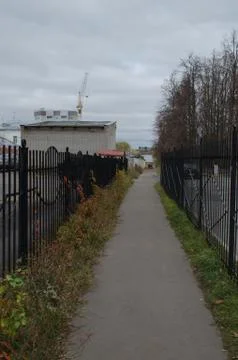 The path between the fences and the prison in a standing area Stock Photos