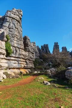 Path between the karstic rocks of the El Torcal de Antequera natural area. Stock Photos