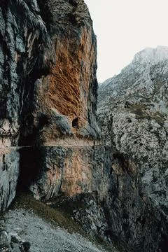 Path in the border of the cliff of the rocky mountain with copy space Stock Photos