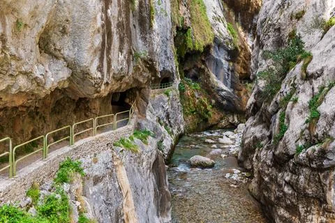 Path of the Cares river, road built in the rock based on tunnels, in the gorg Stock Photos