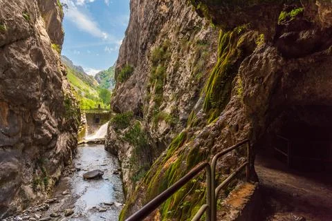 Path of the Cares river, road built in the rock based on tunnels, next to the Stock Photos