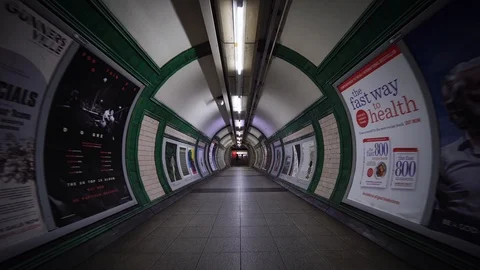 Path for commuters and city workers in London underground subway train station.  Stock Footage 116679844