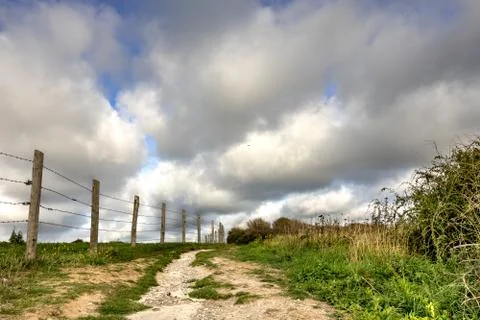 Path in the country, meadows and fields on the opal coast Stock Photos