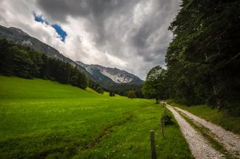 Path on the edge of forest to Schneeberg massif Stock-Fotos