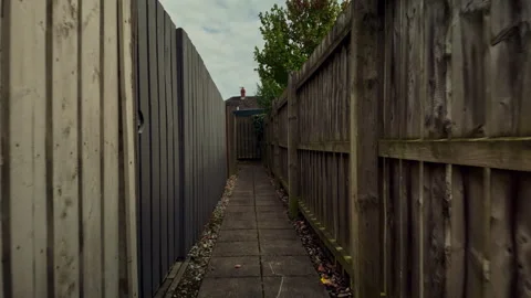 Path with fencing on both sides Stock Footage 343886878
