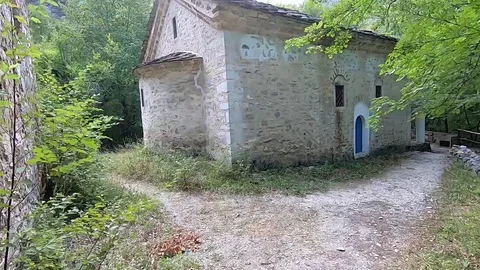 Path from the forest to the mountain stone house Stock Footage 118366659