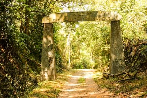 Path in the forest through the gate Stock Photos