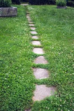 Path in grass between blocks Stock Photos