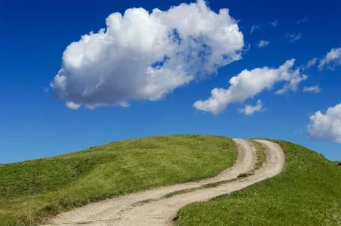 Path on the green hill Stock Photos