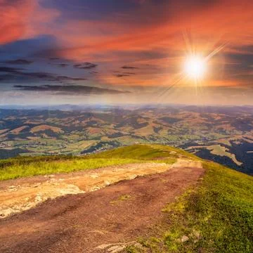 Path  on hillside meadow in mountain Stock Photos