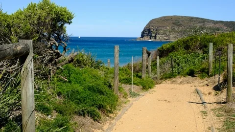 Path leading onto beach with blue sky Stock Footage 93723435