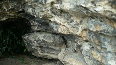 A path leading into a dark stone cave Stock-Footage 116059937