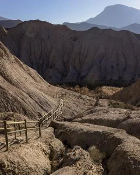 Path leading down into the valley in the desert of Tabernas in Almeria Spain Stock Photos