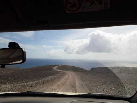 Path leading to the ocean through car window. Uncertain view, future Stock Photos