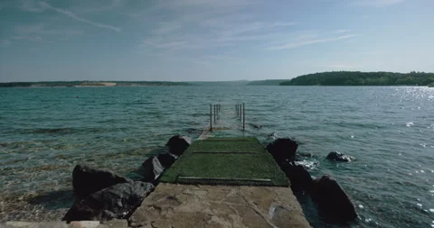 Path leading to the ocean at a vacation resort Stock Footage 254945377