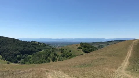 A path leading over dry meadow hills on the Kaiserstuhl, Germany, 4K Stock Footage 146283692