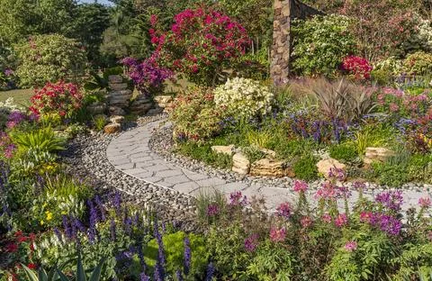 Path leading through a garden Stock Photos