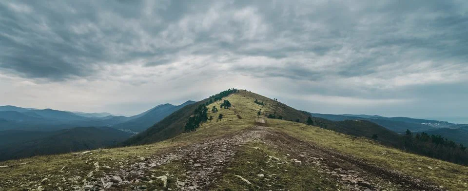 Path leading to the top of mountain Stock Photos