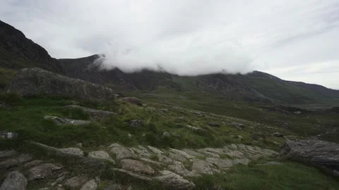 A path leading into the Welsh mountains with low cloud and fog 動画素材 139465224