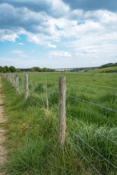 Path leads through fields to viaduct Stock Photos