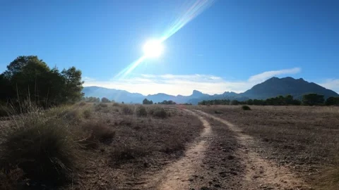 Path in mountain against beautiful landscape of grass field and blue mountain Video stock 146544471