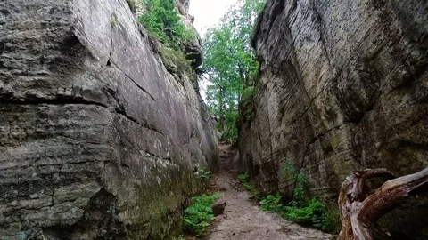 Path as  narrow street among old rock as walls Vidéo 74232198