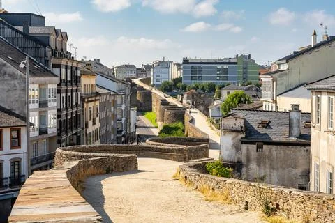 Path over the wall of Roman origin where people walk in the monumental city.. Stock Photos