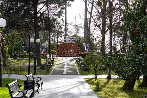 A path in the park and a monument in the shape of the letters Z and V. On th Stock Photos