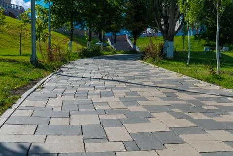 A path in the Park paved with tiles Stock Photos