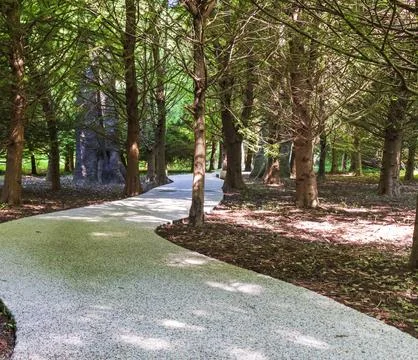 A path paved with small colored pebbles. Texture Stock Photos