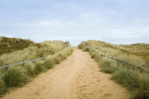Path in sand dunes and grass on beach, Horsey Gap, Norfolk, UK Stock Photos