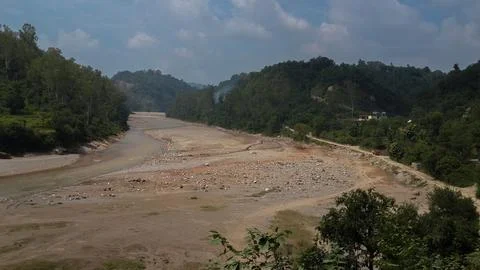 A path ,sandy road with greenery on each side. Stock Photos