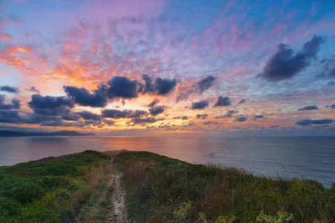 Path to the sea at sunset Stock Photos