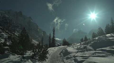 Path in the Snow High Mountain Peaks Clouds 4K Stock Footage 59776404