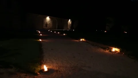 Path surrounded by candles Stock Footage 77295155