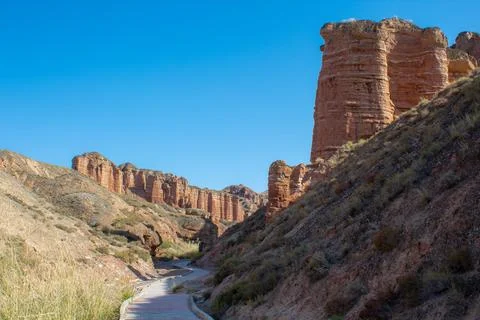 The path through Binggou Danxia landform at Zhangye Danxia national geo par.. Stock Photos