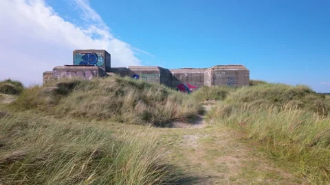 Path through coastal dunes to old bunker in Blavand, Denmark Stock Footage 341700007