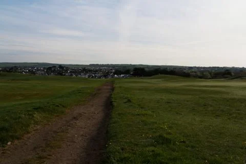 Path through golf course shot at dawn Stock Photos