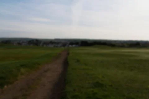 Path through golf course shot at dawn Out of focus. Stock Photos