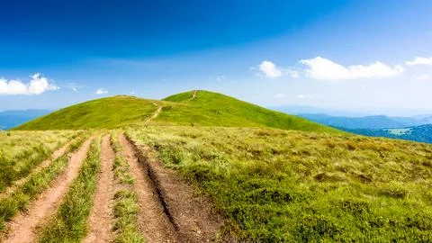 Path through mountain landscape Stock Photos