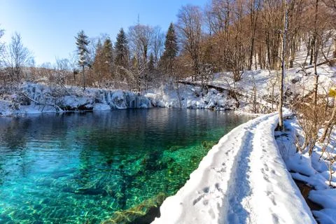 Path thru snow at plitvice lakes during winter, Croatia, Europe Stock Photos