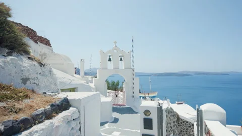 Path towards a gate with two bells in Santorini, Greece Stock Footage 220231557