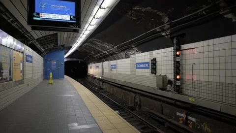 PATH Train arriving at Exchange Place. People exiting train at station. Stock Footage 200675983