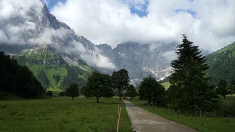 Path with trees and mountains in background mountain Stock Footage 96062046