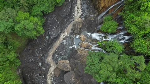 Path to Tumpak Sewu waterfall through winding river on Java Island, Indonesia Video stock 332716480