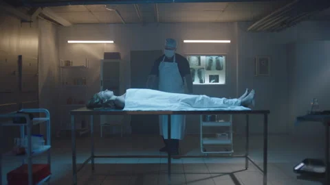 Pathologist and woman's cadaver on the table Stock Footage 283146387